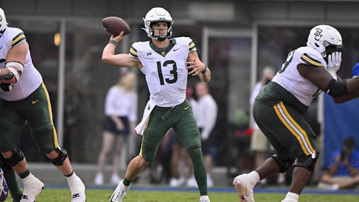 Sep 6, 2025; Dallas, Texas, USA; Baylor Bears quarterback Sawyer Robertson (13) passes the ball during the second quarter against the SMU Mustangs at Gerald J. Ford Stadium. Mandatory Credit: Jerome Miron-Imagn Images Sep 6, 2025; Dallas, Texas, USA; Baylor Bears quarterback Sawyer Robertson (13) passes the ball during the second quarter against the SMU Mustangs at Gerald J. Ford Stadium. Mandatory Credit: Jerome Miron-Imagn Images