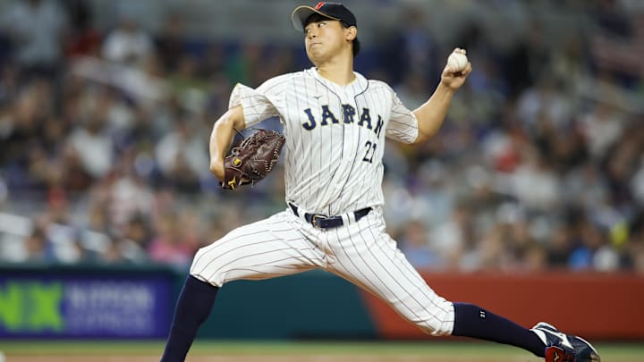 Mar 21, 2023; Miami, Florida, USA; Japan starting pitcher Shota Imanaga (21) delivers a pitch during