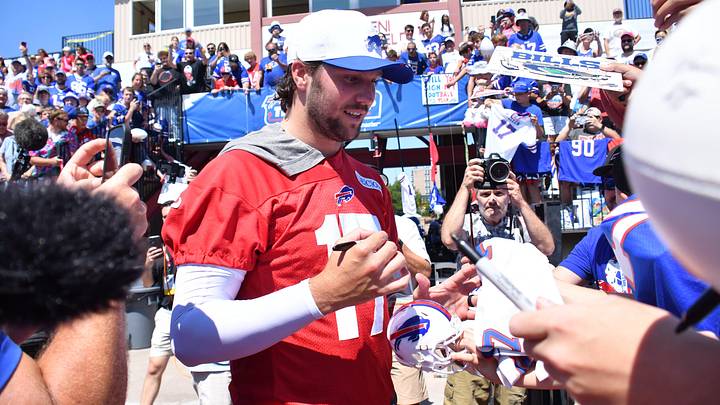 Buffalo Bills quarterback Josh Allen (17) signs autographs during training camp at St. John Fisher University. Buffalo Bills quarterback Josh Allen (17) signs autographs during training camp at St. John Fisher University.