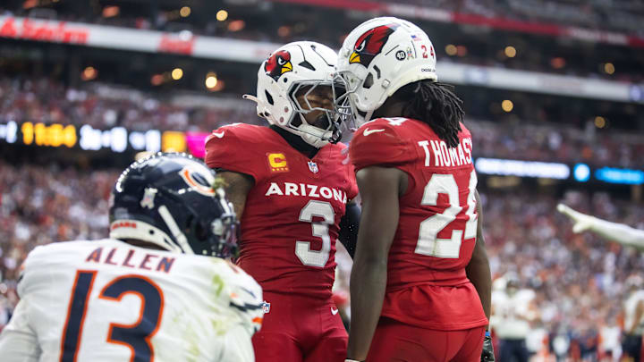 Nov 3, 2024; Glendale, Arizona, USA; Arizona Cardinals safety Budda Baker (3) celebrates a play with cornerback Starling Thomas V (24) against the Chicago Bears in the first half at State Farm Stadium. Mandatory Credit: Mark J. Rebilas-Imagn Images