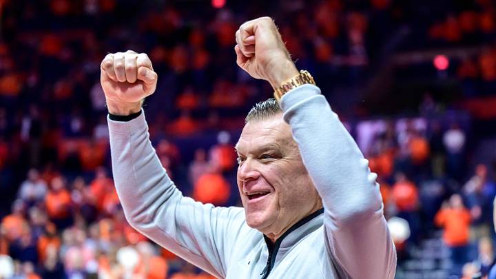 Jan 21, 2026; Champaign, Illinois, USA; Illinois Fighting Illini head coach Brad Underwood greets fans as he enters the floor during pre-game introductions at State Farm Center in a matchup against the Maryland Terrapins.. Mandatory Credit: Fred Zwicky-Imagn Images Jan 21, 2026; Champaign, Illinois, USA; Illinois Fighting Illini head coach Brad Underwood greets fans as he enters the floor during pre-game introductions at State Farm Center in a matchup against the Maryland Terrapins.. Mandatory Credit: Fred Zwicky-Imagn Images