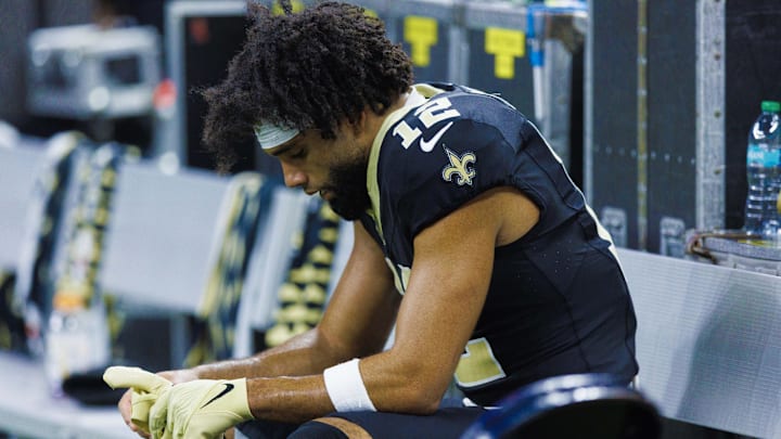 Sep 22, 2024; New Orleans, Louisiana, USA; New Orleans Saints wide receiver Chris Olave (12) reacts to a play in the final minute of the game against the Philadelphia Eagles during the second half at Caesars Superdome. Mandatory Credit: Stephen Lew-Imagn Images