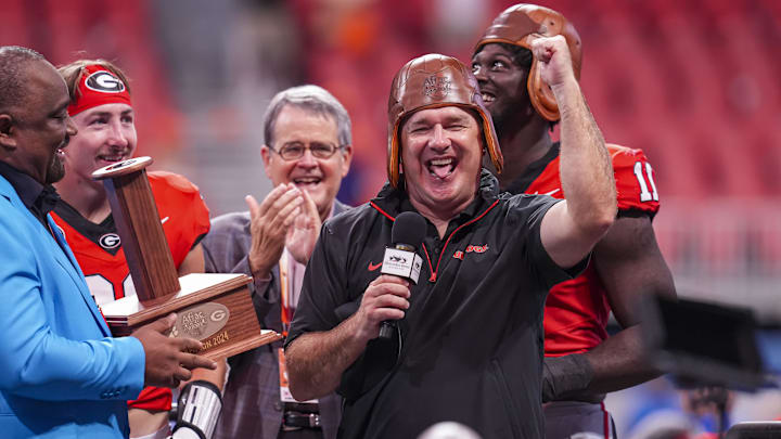 Aug 31, 2024; Atlanta, Georgia, USA; Georgia Bulldogs head coach Kirby Smart wears the old leather helmet after defeating the Clemson Tigers at Mercedes-Benz Stadium. Mandatory Credit: Dale Zanine-Imagn Images Aug 31, 2024; Atlanta, Georgia, USA; Georgia Bulldogs head coach Kirby Smart wears the old leather helmet after defeating the Clemson Tigers at Mercedes-Benz Stadium. Mandatory Credit: Dale Zanine-Imagn Images