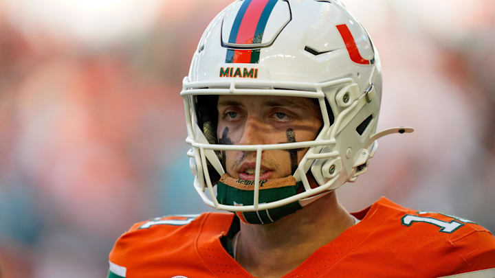 Miami Hurricanes quarterback Carson Beck (11) looks to the bench in a game against the Syracuse Orange during the first quarter at Hard Rock Stadium.