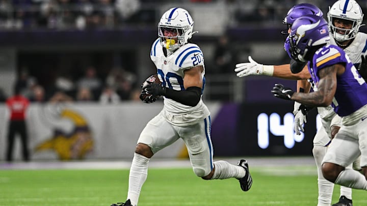 Nov 3, 2024; Minneapolis, Minnesota, USA; Indianapolis Colts safety Nick Cross (20) returns an interception off Minnesota Vikings quarterback Sam Darnold (not pictured) during the fourth quarter at U.S. Bank Stadium. Mandatory Credit: Jeffrey Becker-Imagn Images