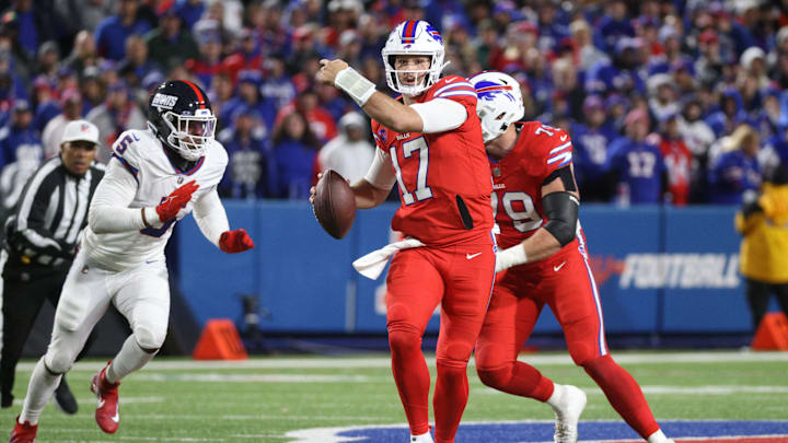 Buffalo Bills quarterback Josh Allen (17) directs his receivers as he is flushes out of the pocket