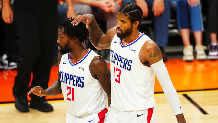 Jun 28, 2021; Phoenix, Arizona, USA; Los Angeles Clippers guard Paul George (13) and Patrick Beverley (21) against the Phoenix Suns in game five of the Western Conference Finals for the 2021 NBA Playoffs at Phoenix Suns Arena. Mandatory Credit: Mark J. Rebilas-Imagn Images