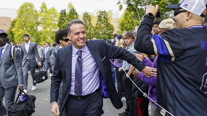 Oct 5, 2024; Seattle, Washington, USA; Washington Huskies head coach Jedd Fisch walks into Alaska Airlines Field at Husky Stadium before a game against the Michigan Wolverines. Mandatory Credit: Joe Nicholson-Imagn Images
