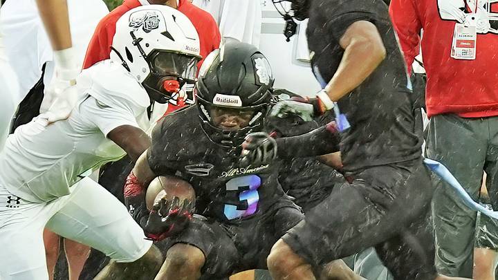Team Rose’s Easton Royal (03) looks for an opening down the field during the Under Armour All-America Game Saturday, Jan. 3, 2026 at Spec Martin Stadium in DeLand.