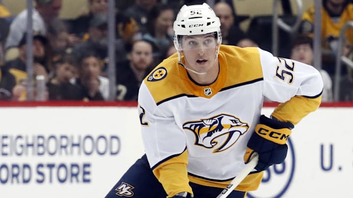 Mar 30, 2023; Pittsburgh, Pennsylvania, USA;  Nashville Predators defenseman Cal Foote (52) skates up ice with the puck against the Pittsburgh Penguins during the third period at PPG Paints Arena. The Penguins shutout the Predators 2-0. Mandatory Credit: Charles LeClaire-Imagn Images