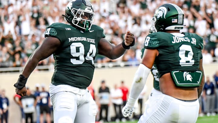 Michigan State's D'Quan Douse, left, celebrates his safety with teammate Anthony Jones during the first quarter in the game against Florida Atlantic on Friday, Aug. 30, 2024, at Spartan Stadium in East Lansing.