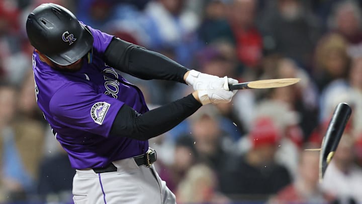 Apr 2, 2025; Philadelphia, Pennsylvania, USA; Colorado Rockies outfielder Kris Bryant (23) breaks his bat while hitting a single during the fifth inning against the Philadelphia Phillies at Citizens Bank Park. 