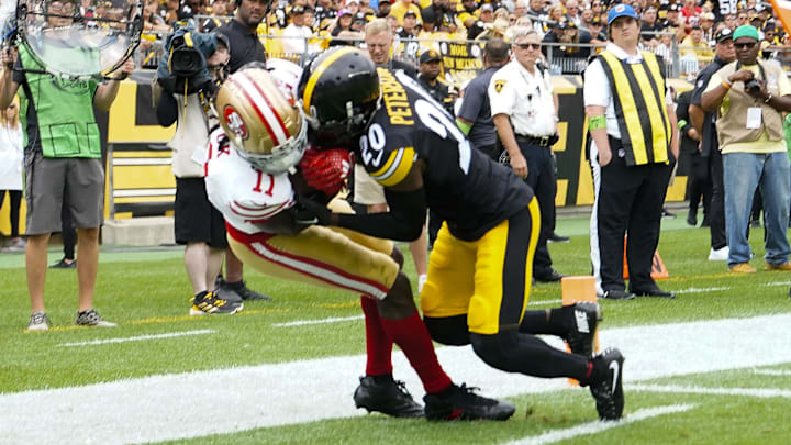 Sep 10, 2023; Pittsburgh, Pennsylvania, USA; San Francisco 49ers wide receiver Brandon Aiyuk (11) catches a pass for a touchdown with Pittsburgh Steelers cornerback Patrick Peterson (20) defending during the first half at Acrisure Stadium. Mandatory Credit: Gregory Fisher-USA TODAY Sports