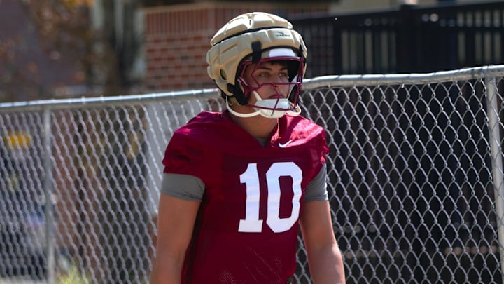 FSU football players walk into the first spring practice of the spring season on Wednesday, March 19, 2025