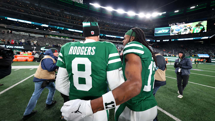 Jan 5, 2025; East Rutherford, New Jersey, USA; New York Jets quarterback Aaron Rodgers (8) and wide receiver Davante Adams (17) walk on the field after the Jets win over the Miami Dolphins at MetLife Stadium. Mandatory Credit: Ed Mulholland-Imagn Images Jan 5, 2025; East Rutherford, New Jersey, USA; New York Jets quarterback Aaron Rodgers (8) and wide receiver Davante Adams (17) walk on the field after the Jets win over the Miami Dolphins at MetLife Stadium. Mandatory Credit: Ed Mulholland-Imagn Images