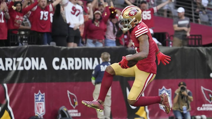 San Francisco 49ers cornerback Charvarius Ward (7) returns an interception for a touchdown against the Arizona Cardinals during the first quarter at State Farm Stadium in Glendale on Dec. 17, 2023. San Francisco 49ers cornerback Charvarius Ward (7) returns an interception for a touchdown against the Arizona Cardinals during the first quarter at State Farm Stadium in Glendale on Dec. 17, 2023.