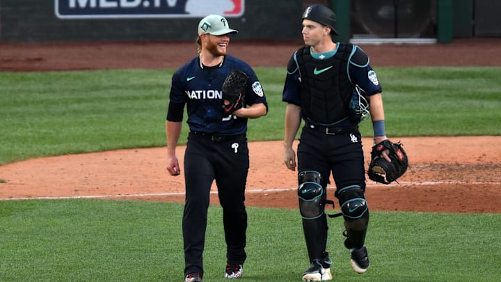 Jul 11, 2023; Seattle, Washington, USA; National League pitcher  Craig Kimbrel  of the Philadelphia Phillies (31) with National League catcher  Will Smith  of the Los Angeles Dodgers (16) reacts with after the ninth inning at T-Mobile Park. Mandatory Credit: Steven Bisig-Imagn Images