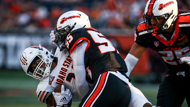 Oregon State Beavers linebacker Dexter Foster (55) takes down Idaho State Bengals running back Dason Brooks (28) during the second half on Saturday, Aug. 31, 2024 at Reser Stadium in Corvallis, Ore.