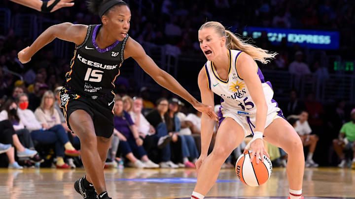 Jul 13, 2025; Los Angeles, California, USA; Los Angeles Sparks guard Julie Vanloo (35) dribbles the basketball as Connecticut Sun guard Lindsay Allen (15) defends during the fourth quarter at Crypto.com Arena. Mandatory Credit: Robert Hanashiro-Imagn Images