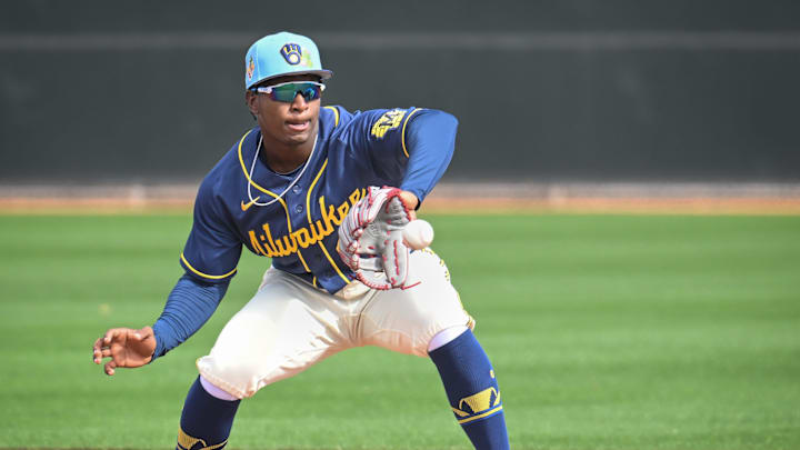 Milwaukee Brewers infield prospect Luis Pena takes a throw in a double-play drill during spring training workouts Sunday, February 15, 2026, at American Family Fields of Phoenix in Phoenix, Arizona.