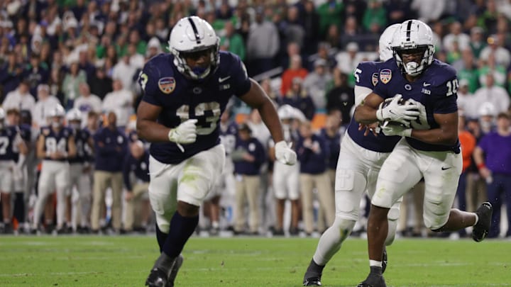 Penn State Nittany Lions running back Nicholas Singleton (10) carries the ball behind Kaytron Allen vs Notre Dame in the Orange Bowl.