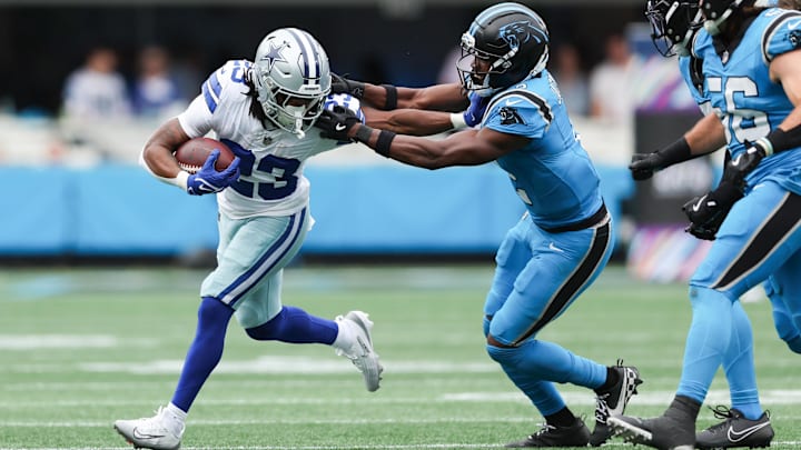 Oct 12, 2025; Charlotte, North Carolina, USA; Dallas Cowboys running back Jaydon Blue (23) runs with the ball during the second quarter against the Carolina Panthers at Bank of America Stadium. 