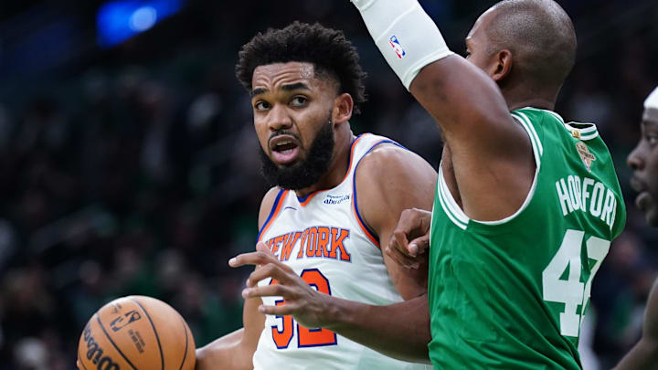 Oct 22, 2024; Boston, Massachusetts, USA; New York Knicks center Karl-Anthony Towns (32) drives the ball against Boston Celtics center Al Horford (42) in the second half at TD Garden. Mandatory Credit: David Butler II-Imagn Images