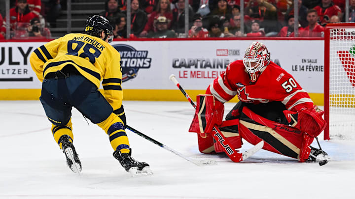 Feb 12, 2025; Montreal, Quebec, CAN; [Imagn Images direct customers only] Team Canada goalie Jordan Binnington (50) makes a save against Team Sweden forward William Nylander (88) in overtime during a 4 Nations Face-Off ice hockey game at Bell Centre. Mandatory Credit: David Kirouac-Imagn Images