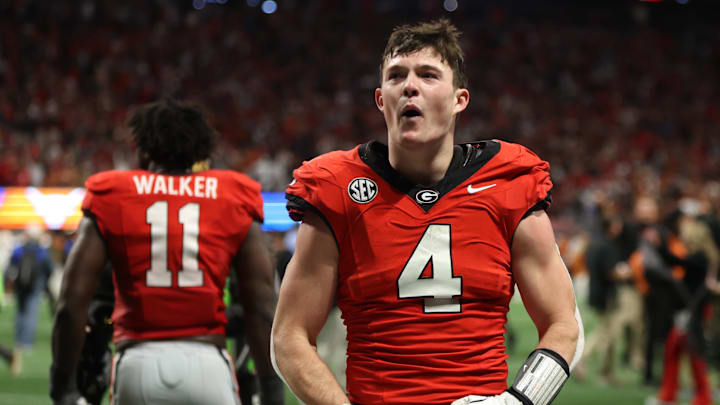 Dec 7, 2024; Atlanta, GA, USA; Georgia Bulldogs tight end Oscar Delp (4) reacts after defeating the Texas Longhorns in overtime in the 2024 SEC Championship game at Mercedes-Benz Stadium. Mandatory Credit: Brett Davis-Imagn Images