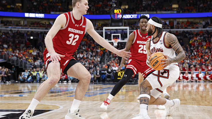 Mar 13, 2026; Chicago, IL, USA; Wisconsin Badgers forward Aleksas Bieliauskas (32) defends against Illinois Fighting Illini guard Kylan Boswell (4) during the second half at United Center. Mandatory Credit: Kamil Krzaczynski-Imagn Images
