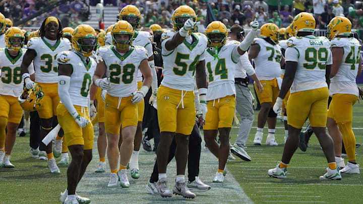 Sep 13, 2025; Evanston, Illinois, USA; Oregon Ducks linebacker Jerry Mixon (54) gestures after intercepting a pass against the Northwestern Wildcats during the second half at Northwestern Medicine Field at Martin Stadium. Mandatory Credit: David Banks-Imagn Images