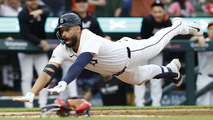 May 12, 2025; Detroit, Michigan, USA;  Detroit Tigers outfielder Riley Greene (31) dives in safe at home third inning against the Boston Red Sox at Comerica Park.