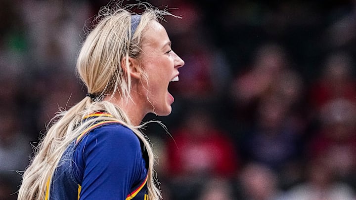 Indiana Fever Sophie Cunningham (8) gets the crowd excited Saturday, May 3, 2025, during a preseason game between the Indiana Fever and the Washington Mystics at Gainbridge Fieldhouse in Indianapolis.