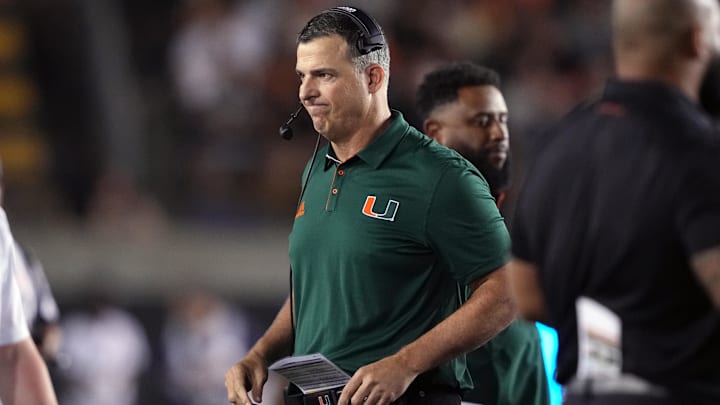 Oct 5, 2024; Berkeley, California, USA; Miami Hurricanes head coach Mario Cristobal walks on the field during a timeout in the second quarter against the California Golden Bears at California Memorial Stadium. Mandatory Credit: Darren Yamashita-Imagn Images Oct 5, 2024; Berkeley, California, USA; Miami Hurricanes head coach Mario Cristobal walks on the field during a timeout in the second quarter against the California Golden Bears at California Memorial Stadium. Mandatory Credit: Darren Yamashita-Imagn Images