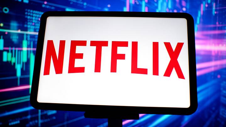 In this photo illustration, the Netflix logo is displayed on
