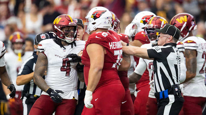 Sep 29, 2024; Glendale, Arizona, USA; Washington Commanders linebacker Frankie Luvu (4) against Arizona Cardinals guard Will Hernandez (76) at State Farm Stadium. Mandatory Credit: Mark J. Rebilas-Imagn Images Sep 29, 2024; Glendale, Arizona, USA; Washington Commanders linebacker Frankie Luvu (4) against Arizona Cardinals guard Will Hernandez (76) at State Farm Stadium. Mandatory Credit: Mark J. Rebilas-Imagn Images