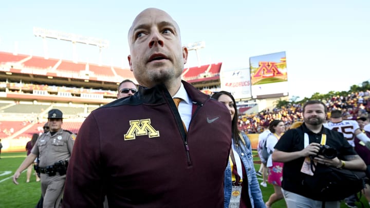 Jan 1, 2020; Tampa, Florida, USA; Minnesota Golden Gophers head coach PJ Fleck (yellow tie) walks on the field after defeating the Auburn Tigers at Raymond James Stadium. Mandatory Credit: Douglas DeFelice-USA TODAY Sports
