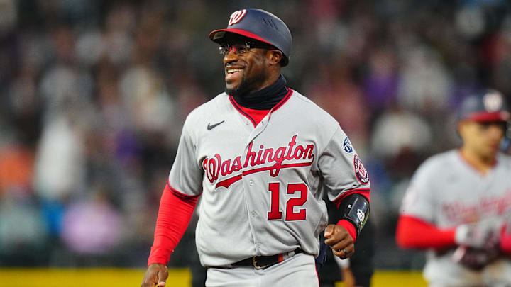 Former Washington Nationals first base coach Eric Young Jr. (12) reacts during a game against the Colorado Rockies on April 8, 2023, at Coors Field.