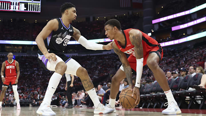 Apr 2, 2025; Houston, Texas, USA; Utah Jazz forward KJ Martin (99) defends as Houston Rockets forward Jabari Smith Jr. (10) controls the ballduring the third quarter at Toyota Center. Mandatory Credit: Troy Taormina-Imagn Images