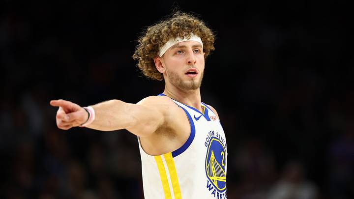 Dec 18, 2025; Phoenix, Arizona, USA; Golden State Warriors guard Brandin Podziemski (2) reacts against the Phoenix Suns in the second half at Mortgage Matchup Center. Mandatory Credit: Mark J. Rebilas-Imagn Images