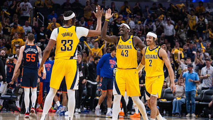 May 12, 2024; Indianapolis, Indiana, USA;  Indiana Pacers forward Pascal Siakam (43) and center Myles Turner (33) guard Andrew Nembhard (2) celebrate a made basket during game four of the second round for the 2024 NBA playoffs against the New York Knicks at Gainbridge Fieldhouse. Mandatory Credit: Trevor Ruszkowski-USA TODAY Sports