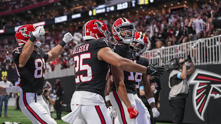 Sep 29, 2024; Atlanta, Georgia, USA; Atlanta Falcons wide receiver KhaDarel Hodge (12) reacts after recovering a muffed punt for a touchdown against the New Orleans Saints during the first quarter at Mercedes-Benz Stadium. Mandatory Credit: Dale Zanine-Imagn Images