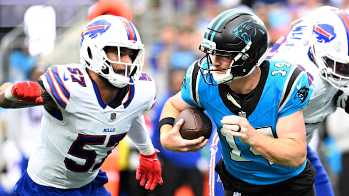 Carolina Panthers' quarterback Andy Dalton (14) and Buffalo Bills' defensive end AJ Epenesa (57). Carolina Panthers' quarterback Andy Dalton (14) and Buffalo Bills' defensive end AJ Epenesa (57).