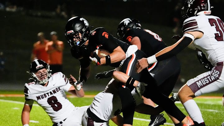 Solon’s Maddox Kelley (4) runs through the defense en route to the endzone for a touchdown during a high school football game against Mount Vernon Sept. 12, 2025 in Solon, Iowa. Solon’s Maddox Kelley (4) runs through the defense en route to the endzone for a touchdown during a high school football game against Mount Vernon Sept. 12, 2025 in Solon, Iowa.