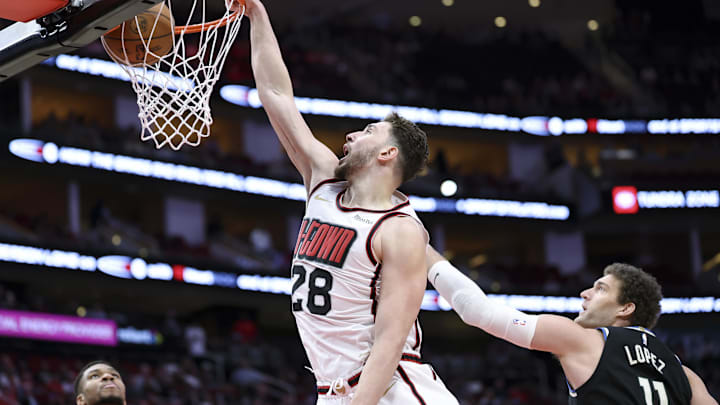Feb 25, 2025; Houston, Texas, USA; Houston Rockets center Alperen Sengun (28) dunks the ball during the first quarter against the Milwaukee Bucks at Toyota Center. Mandatory Credit: Troy Taormina-Imagn Images