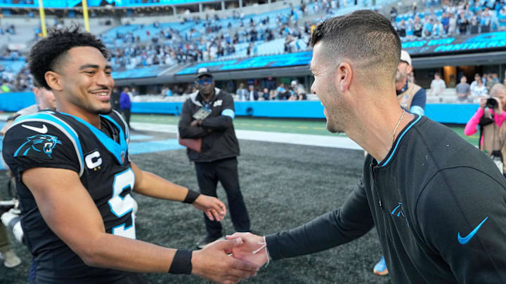Nov 3, 2024; Charlotte, North Carolina, USA; Carolina Panthers quarterback Bryce Young (9) with head coach Dave Canales after the game at Bank of America Stadium. Mandatory Credit: Bob Donnan-Imagn Images Nov 3, 2024; Charlotte, North Carolina, USA; Carolina Panthers quarterback Bryce Young (9) with head coach Dave Canales after the game at Bank of America Stadium. Mandatory Credit: Bob Donnan-Imagn Images