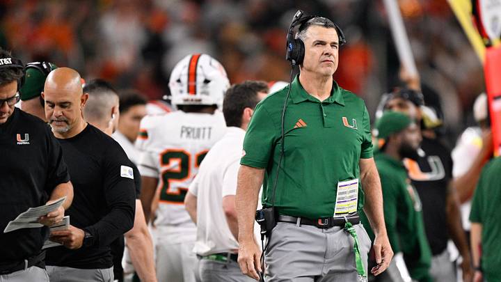 Dec 31, 2025; Arlington, TX, USA; Miami Hurricanes head coach Mario Cristobal looks on during the fourth quarter against the Ohio State Buckeyes during the 2025 Cotton Bowl and quarterfinal game of the College Football Playoff at AT&T Stadium. Mandatory Credit: Jerome Miron-Imagn Images
