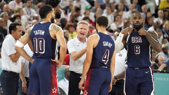 Aug 6, 2024; Paris, France; United States head coach Steve Kerr talks to centre Joel Embiid (11) and small forward Jayson Tatum (10) and shooting guard Stephen Curry (4) and guard LeBron James (6) in the first half against Brazil in a men’s basketball quarterfinal game during the Paris 2024 Olympic Summer Games at Accor Arena. Mandatory Credit: Kyle Terada-USA TODAY Sports Aug 6, 2024; Paris, France; United States head coach Steve Kerr talks to centre Joel Embiid (11) and small forward Jayson Tatum (10) and shooting guard Stephen Curry (4) and guard LeBron James (6) in the first half against Brazil in a men’s basketball quarterfinal game during the Paris 2024 Olympic Summer Games at Accor Arena. Mandatory Credit: Kyle Terada-USA TODAY Sports