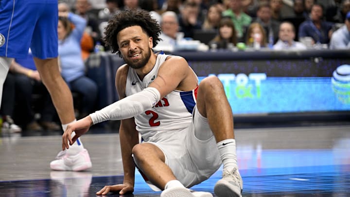Mar 21, 2025; Dallas, Texas, USA; Detroit Pistons guard Cade Cunningham (2) reacts to being knocked to the floor during the second half against the Dallas Mavericks at the American Airlines Center. Mandatory Credit: Jerome Miron-Imagn Images