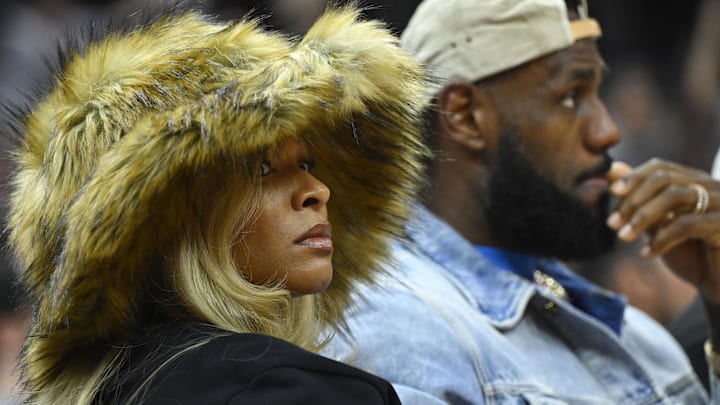 Los Angeles Lakers forward LeBron James and his wife Savannah James watch the game in the second quarter of game four of the second round for the 2024 NBA playoffs between the Cleveland Cavaliers and the Boston Celtics.